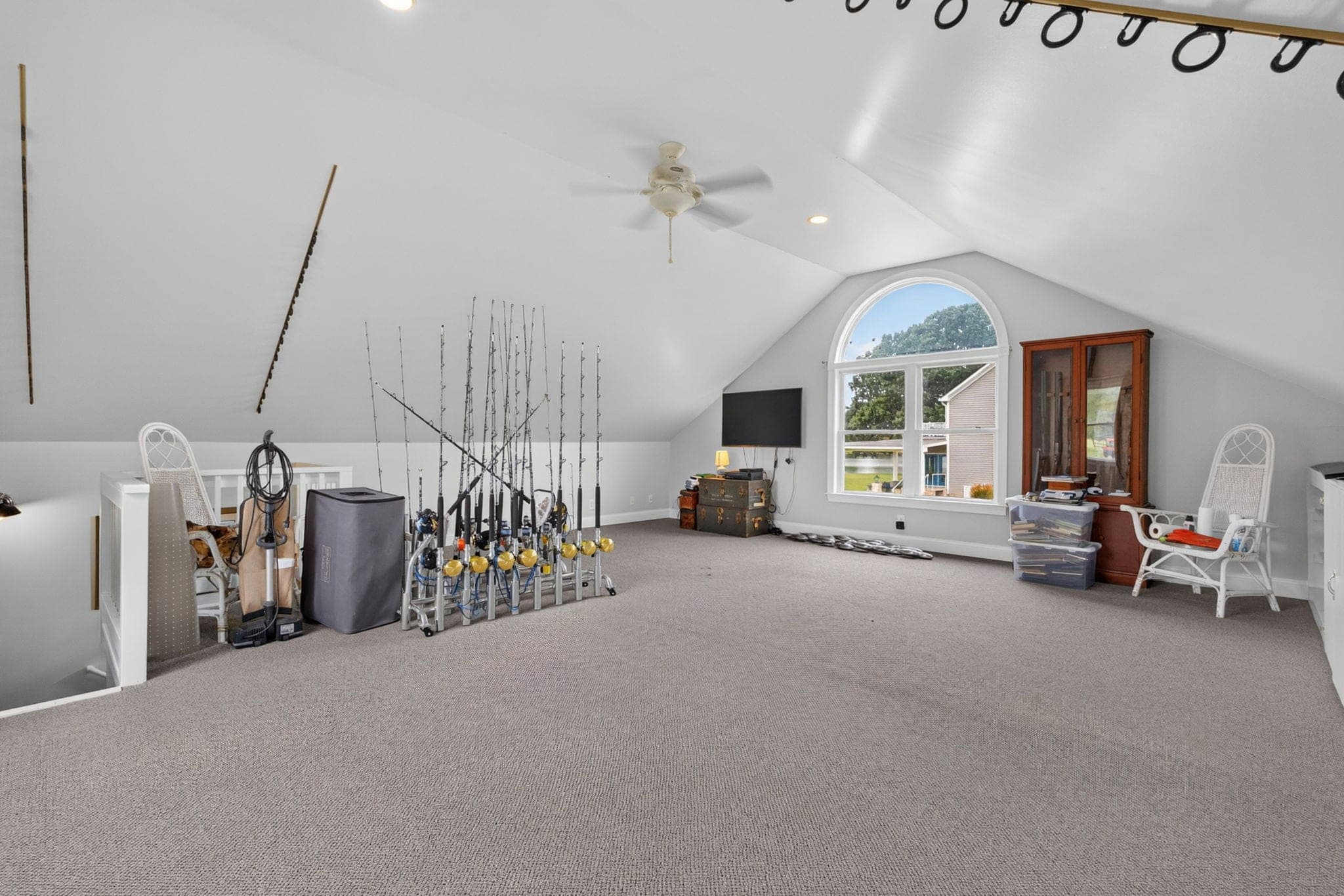 The conditioned bonus room over the detached garage, plumbing already roughed in for a bath.